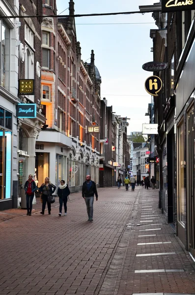 Amsterdam, Netherlands - May 7, 2015: Unidentified people Shopping on Kalverstraat, main shopping street of Amsterdam.