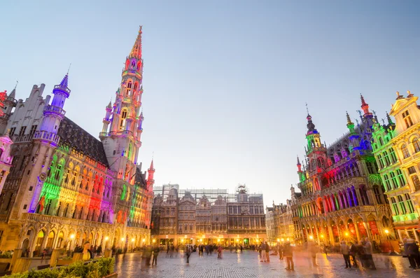 Brussels, Belgium - May 13, 2015: Tourists visiting famous Grand Place the central square of Brussels.