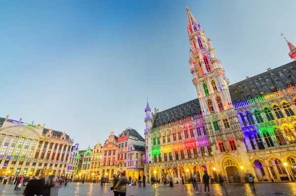 Brussels, Belgium - May 13, 2015: Tourists visiting famous Grand Place (Grote Markt) the central square of Brussels.