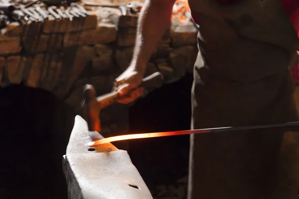 Blacksmith forging steel