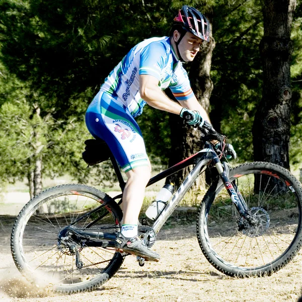 Cyclist on mountain bike racing making a career in the field