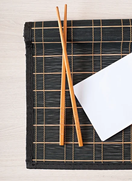 Sushi menu chopsticks for sushi on bamboo napkin