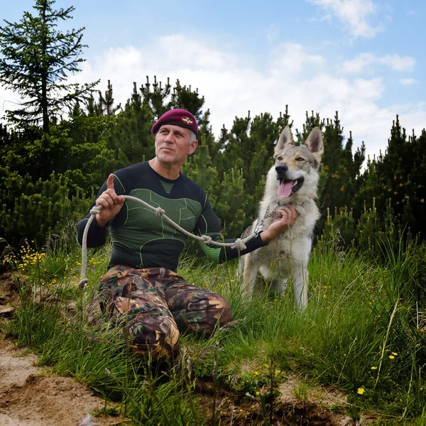 Man and his purebred Czechoslovakian wolf dog