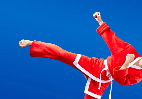 In cloth Santa Claus athlete beats kicking