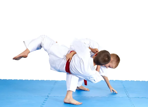 Sportsmens are training judo throws