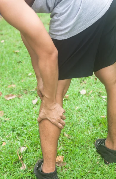 Leg calf sport muscle injury. Runner with muscle pain in leg