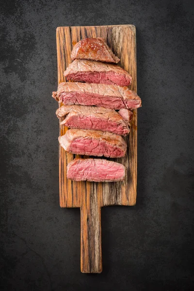 Steak on wooden board