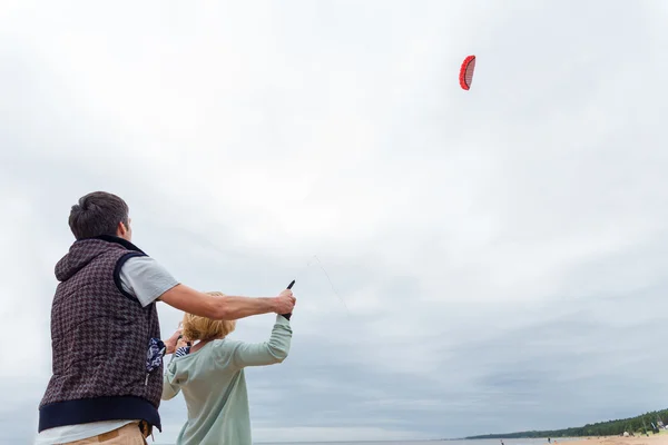 Coach teaches girl control the kite