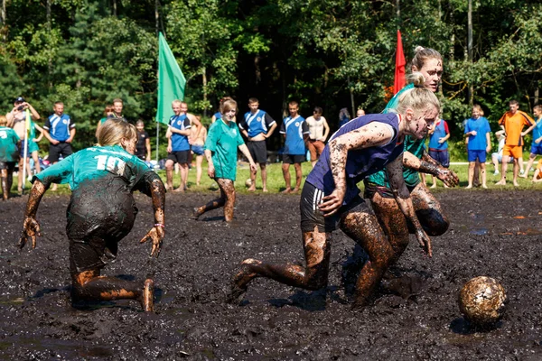 Women battle for the ball in the Open Belarusian championship on marsh football