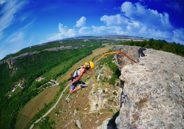 Jump off a cliff with a rope . Crimea. Kachy-Kalion.