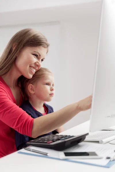 Mother and daughter at computer