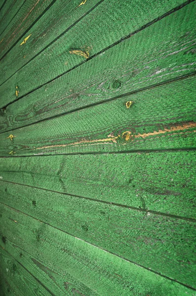 Green wooden background.