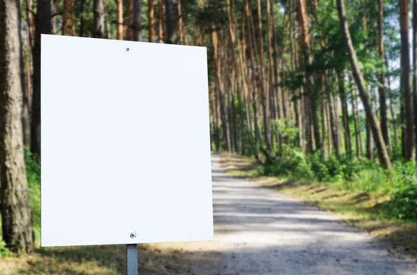 White billboard at the park with space for your advertisement