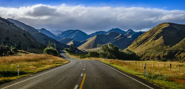 Straight empty road in the mountain, New Zealand