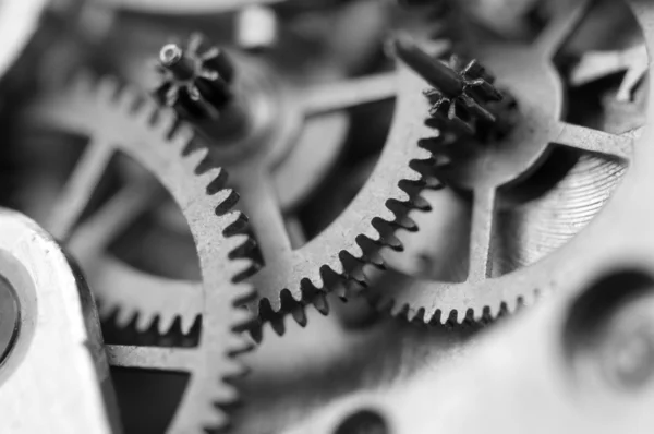 Black white background with metal cogwheels a clockwork. Concept