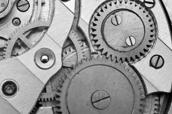 Black-and-white Metal Cogwheels in Clockwork. Macro