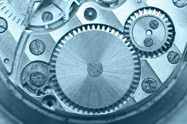 Gear wheels inside clock. Concept Teamwork. Macro