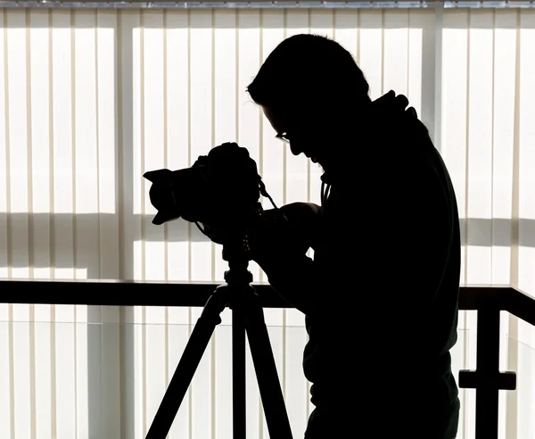 Silhouette of photographer and cameraman