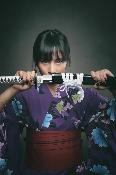 Japanese woman with samurai sword