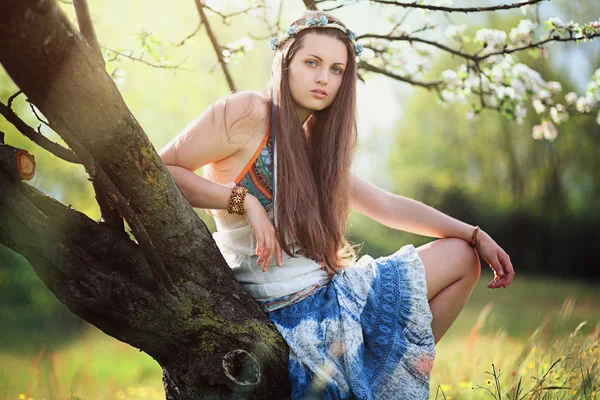 Romantic woman in flower meadow