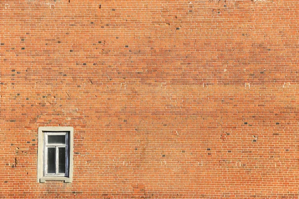 Old brick wall with window