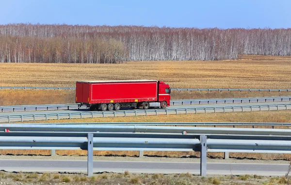 Truck with trailer goes on the highway