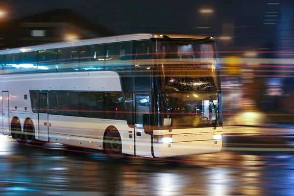 Bus moves in the night city