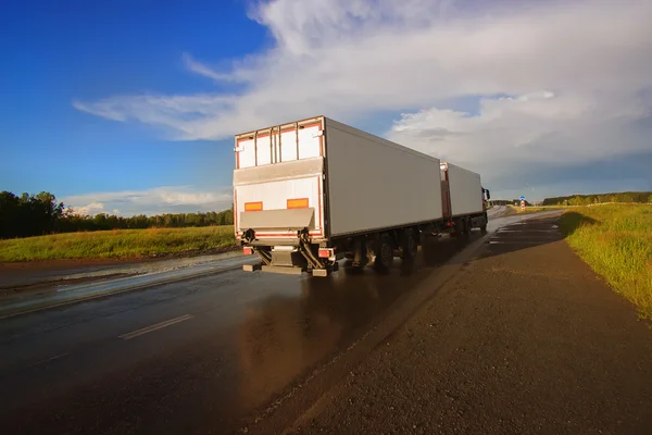 Truck and highway at sunset