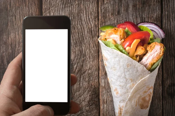 Blank screen on cellphone and tortilla wrap