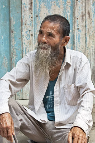 A wonderful 80 year old man with the Han Ethnic Tribe from the ancient town of Daxu, Guangxi Zhuang Autonomous Region, Guilin China