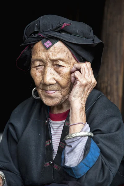 A beautiful 96 year old woman from the Hong Yao ethnic group living in the village of Dazhai, part of the Dragons Backbone Rice Terraces, Longji. Guangxi Zhuang Autonomous Region. Guilin, China