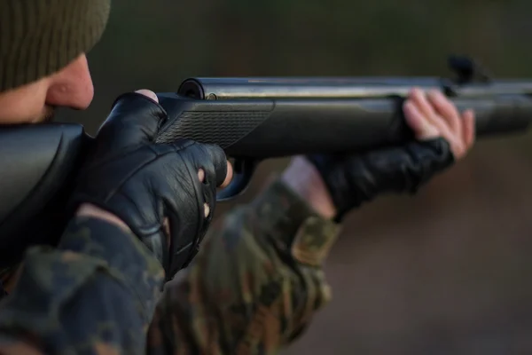 A rifle butt  a pneumatic rifle. Barrel of rifle