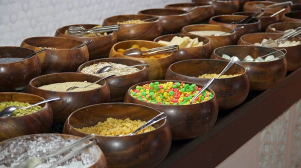 Cereals and Corn Flakes on a Breakfast Buffet