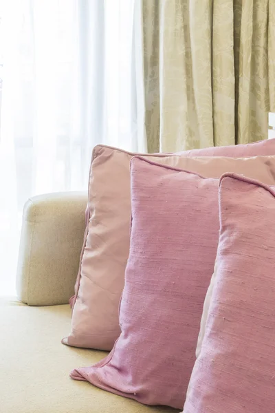 Row of cute pink pillows