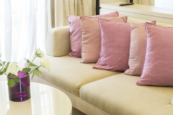 Row of cute pink pillows