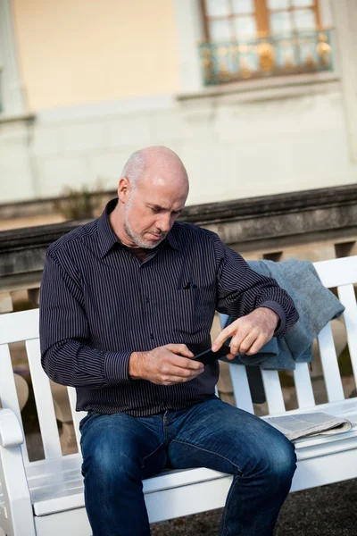 Man checking a photo on his mobile phone