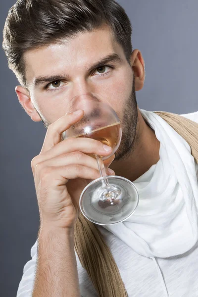 Sexy  man drinking white wine