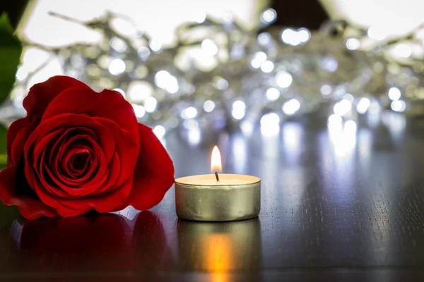 Beautiful rose and small candle
