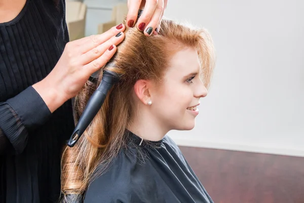 Woman Having Hair Cut in Salon