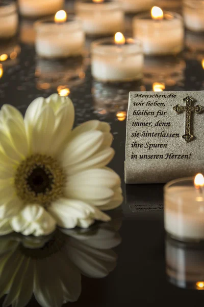 Funeral card with flowers and candles