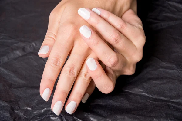 Close up of hands with nail polish