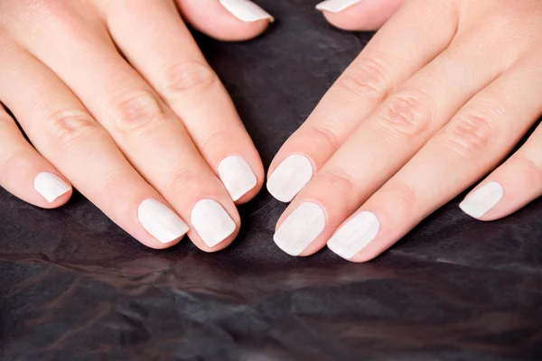 Close up of hands with nail polish