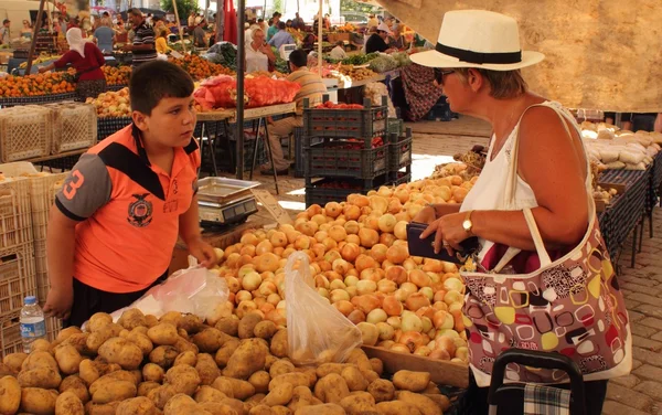 An english lady buying fresh market produce