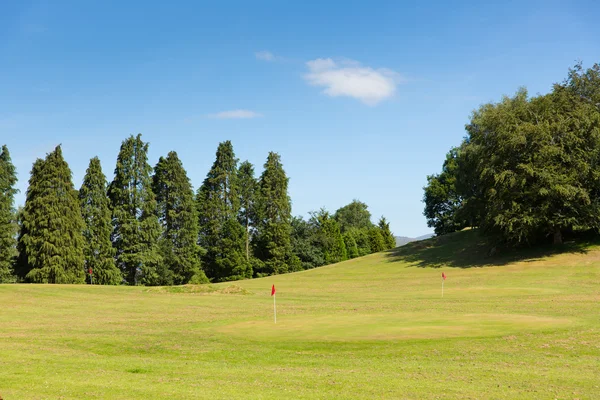 Bowness on Windermere Golf mini golf course Cumbria Lake District a popular tourist activity in summer with sunshine and blue sky