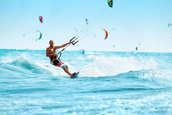 Recreational Sports. Man Kiteboarding In Sea Water. Extreme Sport