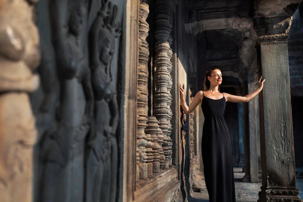 Cambodia Tourist Attraction. Happy Woman In Angkor Wat Temple. T