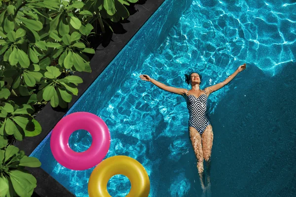 Summer Relax. Woman Floating, Swimming Pool Water. Summertime Holidays