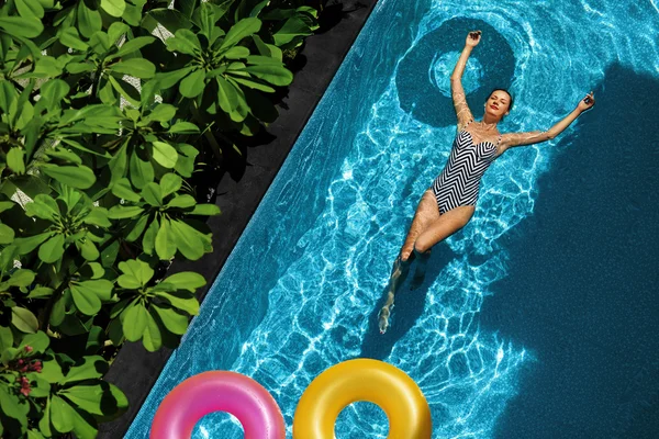 Summer Relax. Woman Floating, Swimming Pool Water. Summertime Holidays