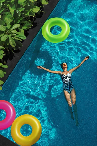 Summer Relax. Woman Floating, Swimming Pool Water. Summertime Holidays