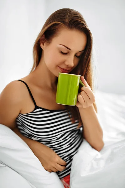 Drink Morning Tea. Woman Drinking Beverage In Bed. Healthy Lifestyle